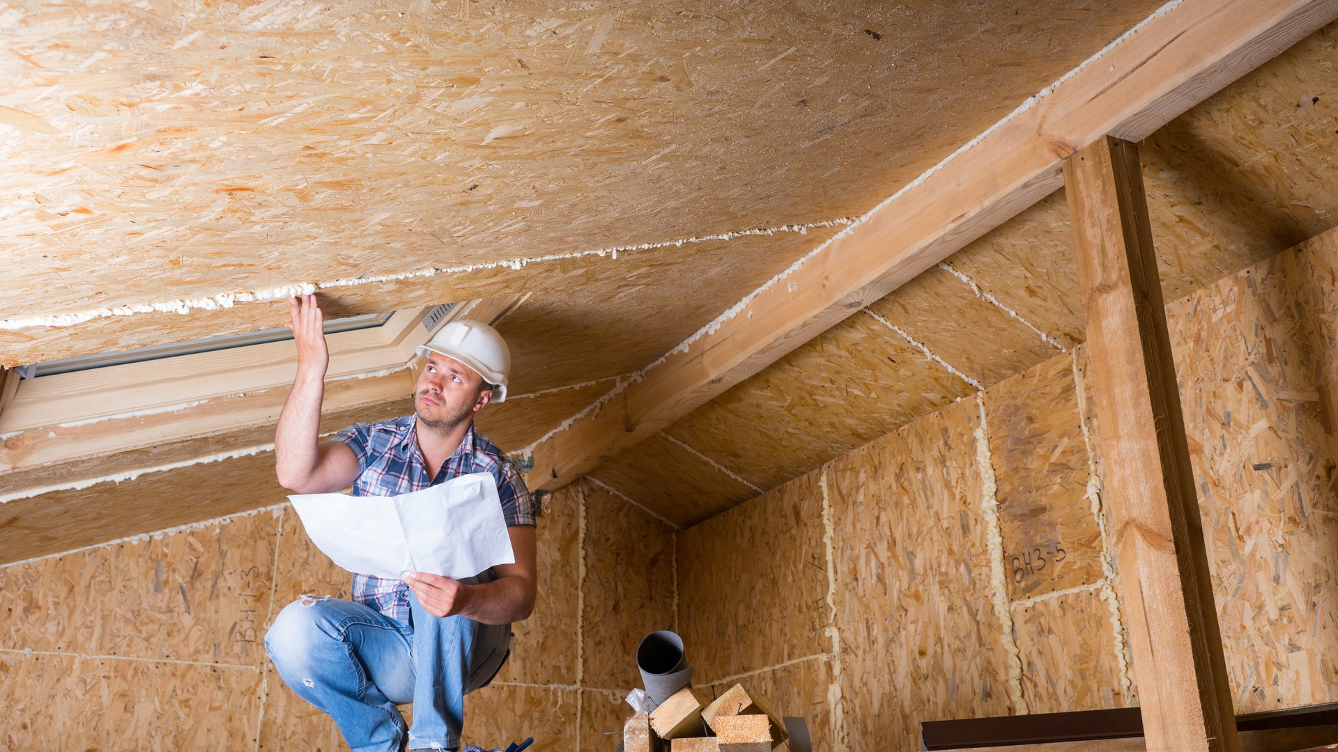 Home inspector with clipboard or tablet evaluating a residential basement HVAC and water heater during an annual home inspection in a Bucks County Pennsylvania home.